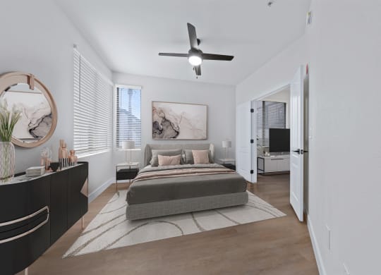 a bedroom with a bed and a ceiling fan